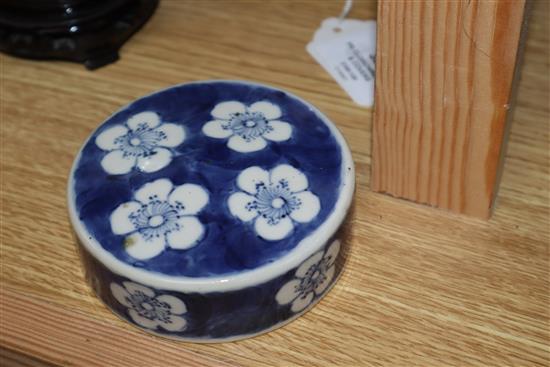 Two Chinese blue and white jars and covers and a pair of hardwood stands